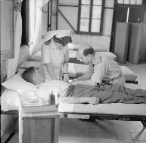 A patient receiving an injection of pentothal at No 41 General Hospital, Kantara East, which specialised in psychiatric treatment. © IWM (E 24690)